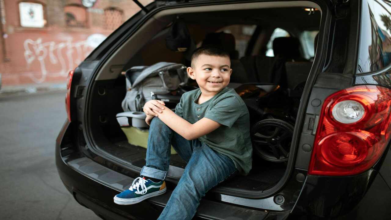 child in car boot